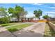 Inviting single-story home featuring a well-maintained lawn and long driveway on a sunny day at 9220 Yucca Way, Thornton, CO 80229