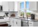 Bright kitchen with white cabinets, stainless steel appliances, and modern fixtures at 9220 Yucca Way, Thornton, CO 80229