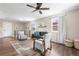 Bright living room featuring hardwood floors, stylish furniture, and ample natural light at 9220 Yucca Way, Thornton, CO 80229