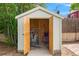 Outdoor shed with open doors, revealing ample storage space for bicycles and outdoor equipment at 9220 Yucca Way, Thornton, CO 80229