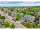 Aerial view of the property showcasing mature trees, landscaping, and neighborhood at 7837 Aravon Ct, Lone Tree, CO 80124