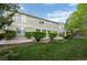 Private backyard featuring a well-manicured lawn, mature landscaping, and a cozy patio area at 7837 Aravon Ct, Lone Tree, CO 80124