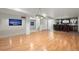 Open basement layout with entertainment area, bar, and sleek flooring, perfect for gatherings at 7837 Aravon Ct, Lone Tree, CO 80124
