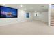 Spacious carpeted basement with a large entertainment area and neutral color palette at 7837 Aravon Ct, Lone Tree, CO 80124