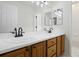Bathroom featuring dual sinks with modern fixtures and ample counter space at 7837 Aravon Ct, Lone Tree, CO 80124