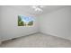 Cozy bedroom with neutral carpet, bright windows, and ample closet space at 7837 Aravon Ct, Lone Tree, CO 80124