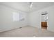 Comfortable carpeted bedroom with natural light and ensuite bath access at 7837 Aravon Ct, Lone Tree, CO 80124