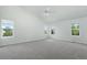 Bright bedroom featuring carpet flooring, neutral paint, natural light, and simple decor at 7837 Aravon Ct, Lone Tree, CO 80124