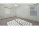 Well-lit bedroom with plush carpet and large windows, creating a welcoming space at 7837 Aravon Ct, Lone Tree, CO 80124