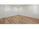 Bright bedroom features modern hard wood floors, a large window, and neutral paint at 7837 Aravon Ct, Lone Tree, CO 80124