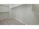 Walk-in closet space with laminate flooring, shelves, and clothing rack at 7837 Aravon Ct, Lone Tree, CO 80124