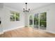 A light and bright dining room with hardwood floors, a sliding glass door, and natural light at 7837 Aravon Ct, Lone Tree, CO 80124