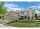Charming two-story home features a well-maintained lawn, a three-car garage and appealing stone detailing at 7837 Aravon Ct, Lone Tree, CO 80124