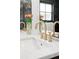 Bathroom featuring double sink vanity, stylish faucet fixture, and decorative floral arrangement at 121 S Ivy St, Denver, CO 80224