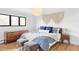Comfortable bedroom featuring a large bed, modern dresser, and stylish decor at 121 S Ivy St, Denver, CO 80224