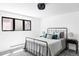 Bright bedroom offering a large window, cozy bed, and tasteful decor at 121 S Ivy St, Denver, CO 80224