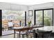 Dining area with access to an outdoor seating area, featuring a wood table and chairs at 121 S Ivy St, Denver, CO 80224