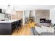 Spacious living area featuring a modern kitchen, central island, fireplace, and stairwell at 121 S Ivy St, Denver, CO 80224