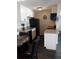 Small kitchen with white cabinets and black appliances at 3100 S Federal Blvd # 203, Denver, CO 80236