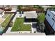 Aerial shot of a quaintly renovated home with well manicured yard, black fencing and mature landscaping at 640 N Magnolia St, Denver, CO 80220