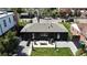 Aerial view of a black home and lush backyard with a cozy outdoor seating area at 640 N Magnolia St, Denver, CO 80220