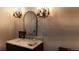Elegant bathroom features a marble countertop sink, chandelier lighting, and stylish fixtures at 640 N Magnolia St, Denver, CO 80220