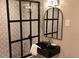 Bathroom showcasing dark framed shower and mirror with stylish sink and light fixtures at 640 N Magnolia St, Denver, CO 80220