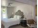 Bright bedroom features a queen bed with a decorative headboard, side tables, and natural light from the window at 640 N Magnolia St, Denver, CO 80220