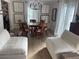 Open-concept dining room with hardwood floors, elegant lighting, and comfortable seating at 640 N Magnolia St, Denver, CO 80220