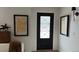 Inviting entryway with frosted glass door, framed prints and sculpture adding a touch of elegance at 640 N Magnolia St, Denver, CO 80220