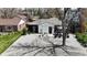 Wide angle shot of a charming home with a well manicured gravel yard and quaint decor throughout at 640 N Magnolia St, Denver, CO 80220