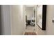 Hallway leading to bedroom with views of comfy chair and bedside table and decor at 640 N Magnolia St, Denver, CO 80220