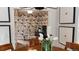 Stylish home office featuring crane-themed wallpaper, desk, and comfortable seating viewed from a dining room at 640 N Magnolia St, Denver, CO 80220
