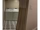 Basement laundry area with updated appliances and decorative flooring at 640 N Magnolia St, Denver, CO 80220