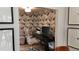 Well-lit home office features unique wallpaper, modern desk, and comfortable ergonomic chair at 640 N Magnolia St, Denver, CO 80220