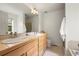 Bright bathroom featuring a double vanity, tile floors, and a large mirror at 3712 Wolff St, Denver, CO 80212