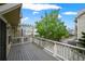 View from deck with wood railing overlooking a neighborhood at 3712 Wolff St, Denver, CO 80212