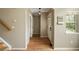 Entryway featuring hardwood floors, staircase, and convenient built-in storage at 3712 Wolff St, Denver, CO 80212