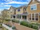 Townhome featuring landscaped entrance with inviting walkways and vibrant foliage at 3712 Wolff St, Denver, CO 80212