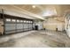 Spacious two-car garage with a roll up door and concrete floors at 3712 Wolff St, Denver, CO 80212