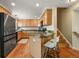 Bright kitchen with stainless steel appliances and breakfast bar at 3712 Wolff St, Denver, CO 80212