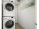 This laundry room features a stacked washer and dryer for space-saving convenience and functionality at 3712 Wolff St, Denver, CO 80212