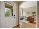 Open concept living room view from entryway with stylish decor and hardwood floors at 3712 Wolff St, Denver, CO 80212