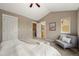 Main bedroom with ensuite bath, neutral walls, vaulted ceiling, and natural light at 3712 Wolff St, Denver, CO 80212