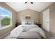 Main bedroom featuring a king bed, neutral decor, and a large window with a view at 3712 Wolff St, Denver, CO 80212