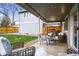 Covered patio with outdoor seating and string lights, perfect for entertaining guests at 3706 E Easter Dr, Centennial, CO 80122