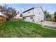Spacious backyard with lush green grass and a charming fence, ideal for outdoor activities at 3706 E Easter Dr, Centennial, CO 80122
