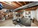Unfinished basement space, perfect for a home gym or storage with exposed beams at 3706 E Easter Dr, Centennial, CO 80122