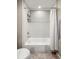 Clean bathroom features a bright white tiled tub and shower combination at 3706 E Easter Dr, Centennial, CO 80122