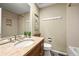 Bathroom with a marble countertop, large mirror, and plenty of cabinet space at 3706 E Easter Dr, Centennial, CO 80122